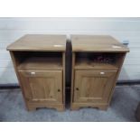 A pair of bedside cabinets, approximatel