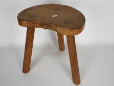 A Robert Mouseman Thompson oak cow stool