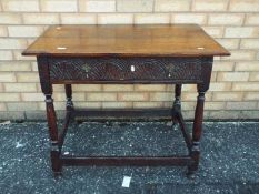 A side table with carved detailing and s