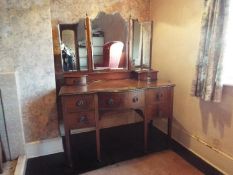 A dressing table with triptych mirror, a