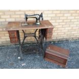 A Singer sewing machine table with sewin