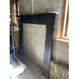 A Victorian cast iron fire surround meas