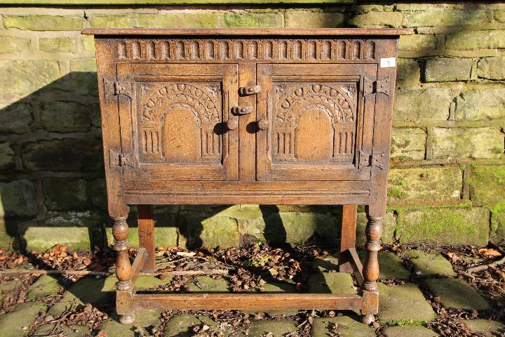 A small side cupboard with carved decora - Image 2 of 3
