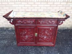 A altar cabinet style sideboard with bra