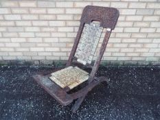 An Indian carved wood folding chair, pro