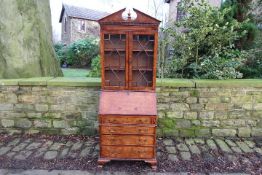 A burr wood veneered bureau bookcase, as