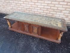 A coffee table with relief carved decora