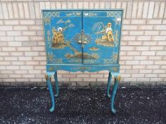 A Chinoiserie drinks cabinet with brass