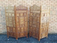An Indian four fold carved wood screen w