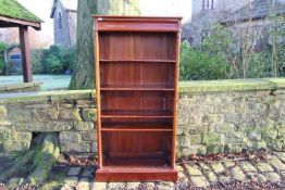 A mahogany open bookcase measuring appro