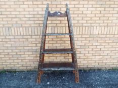 An Indian open bookcase / shelving unit