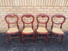 Four balloon back chairs with cane seats