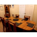 An extending dining table and six dining