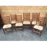 Four ladder back chairs and two carvers.