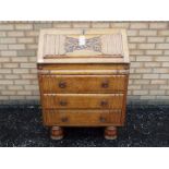 An oak fall front writing bureau with ca