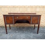 A mahogany sideboard with central frieze