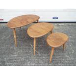 An Ercol Pebble nest of three tables, la