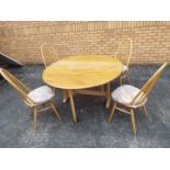 An Ercol drop leaf dining table, approxi