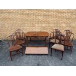 A mahogany extending dining table with c