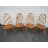 A set of four Ercol stick back chairs. [