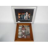 Two framed images of boxers bearing signatures comprising Amir Khan and Muhammad Ali,