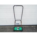 A Powerbase GCL30H manual lawnmower.