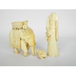 An antique Indian ivory carving depicting an elephant and howdah, approximately 7.