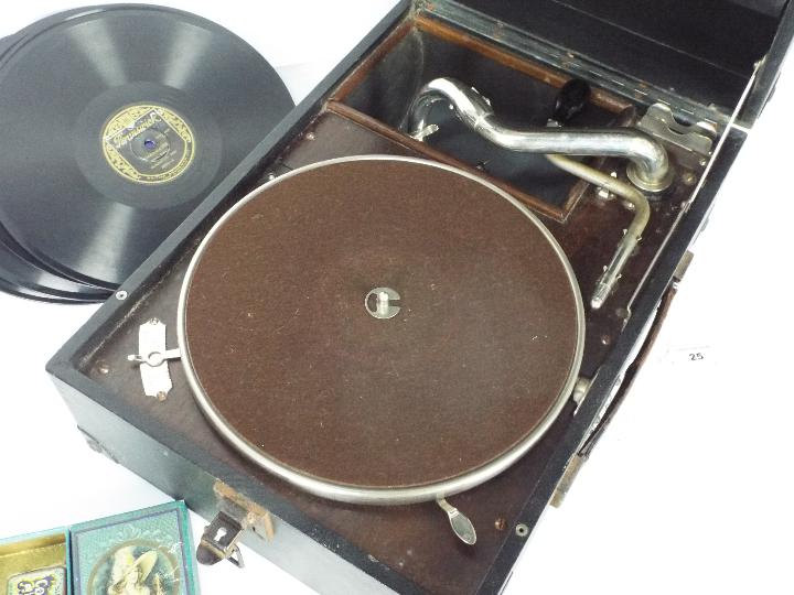 A HMV portable, table top gramophone with a small quantity of records and additional needles. - Image 2 of 7