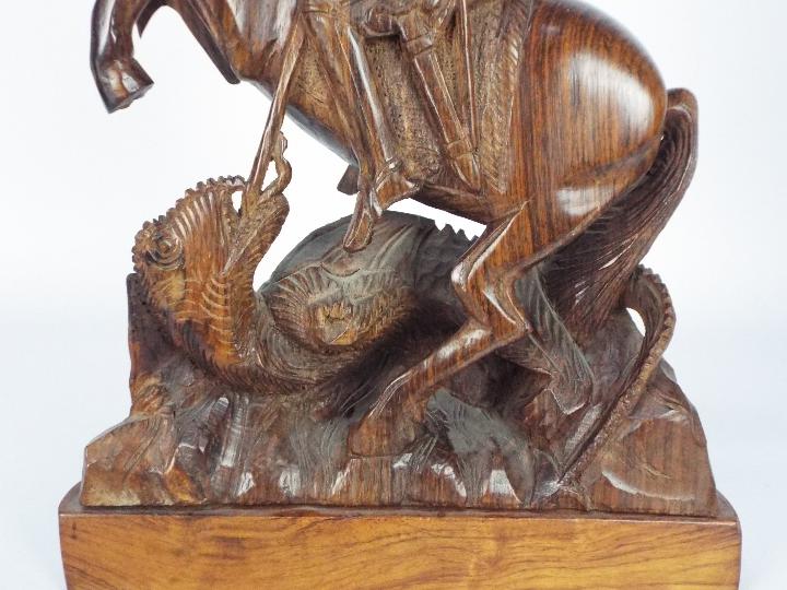 A wooden carving depicting St George and the dragon, - Image 3 of 4
