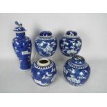 A collection of blue and white ginger jars and a covered vase,