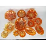 Carnival Glass - A large collection of orange carnival glass to include plates, bowls and other.