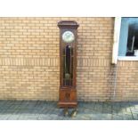 An early 20th century oak cased longcase clock, hour and half past gong striking movement,