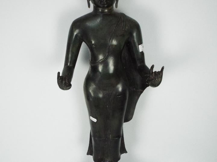 A large metal standing Buddha atop double lotus base, - Image 3 of 4