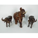Ethnographica - Three hardwood carving of animals comprising a pair of Cape buffalo and an elephant,