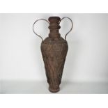 A large iron vase or amphora with twin handles, approximately 72 cm (h).
