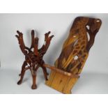 Ethnographica - A folding chair with carved decoration of giraffe and a folding bowl stand.