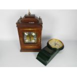 A wood cased mantel clock with brass mounts (replacement quartz movement),