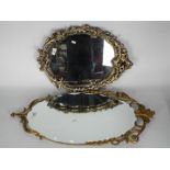 Two decorative wall mirrors, largest approximately 86 cm x 39 cm.