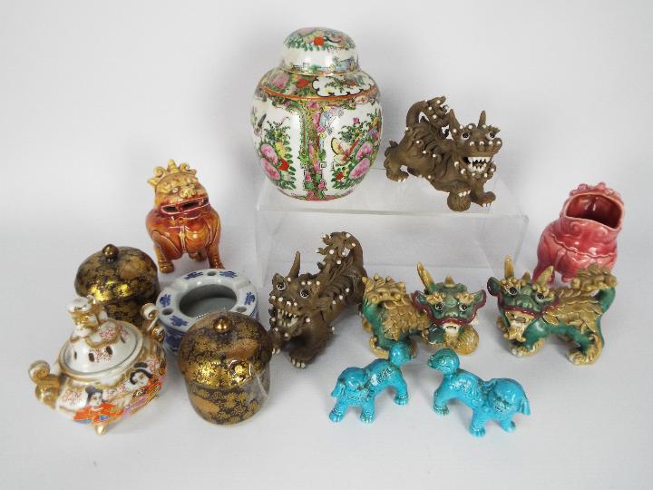 Oriental ceramics group to include Chinese ginger jar, Buddhist lions and similar.