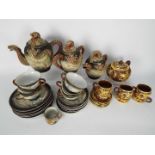 A collection of Oriental tea wares with dragon decoration.