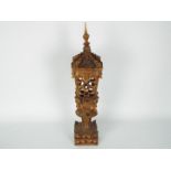 An Asian carved wood lantern, approximately 51 cm (h).