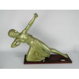An Art Deco style plaster figurine of a female archer on wall mountable plinth,