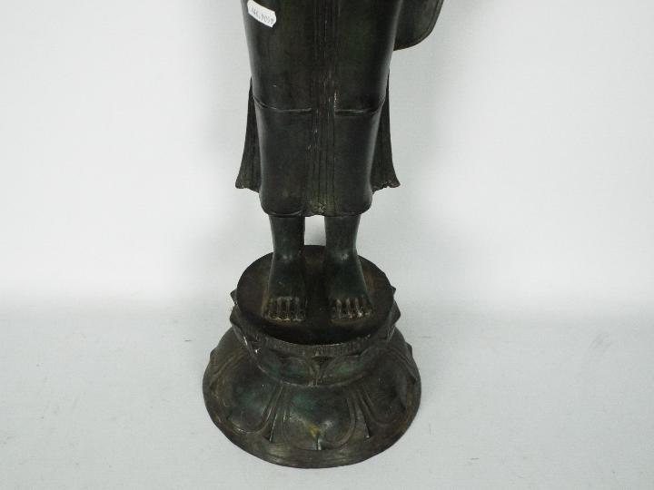 A large metal standing Buddha atop double lotus base, - Image 4 of 4