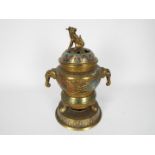 A brass champleve enamel censer and cover with elephant mask handles, approximately 24 cm (h).
