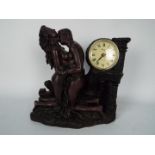 A cold cast bronze mantel clock in the form of two lovers after Crosa, approximately 28 cm (h).