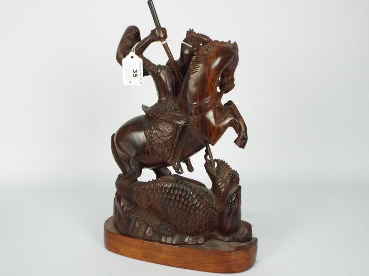 A wooden carving depicting St George and the dragon, - Image 4 of 4