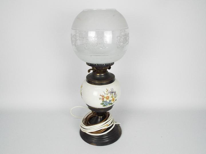 A converted oil lamp with ceramic reserv