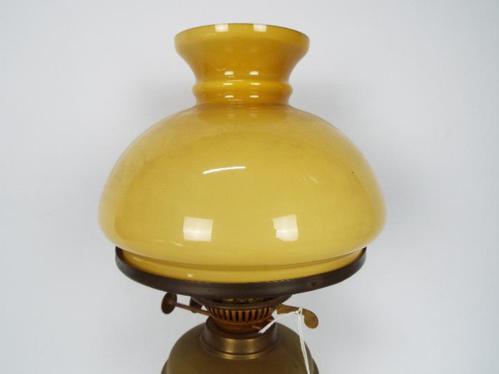 A vintage brass oil lamp with glass shad - Image 2 of 3