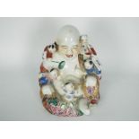 A famille rose Budai and boys group, 20t