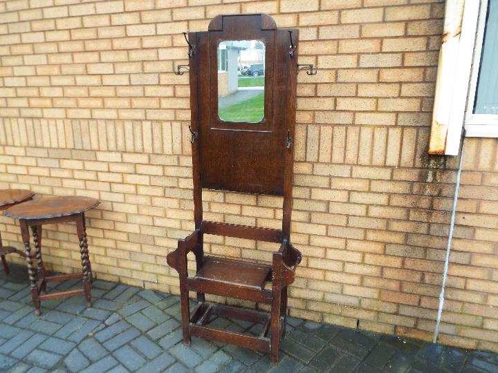 A hall stand with central mirror and box